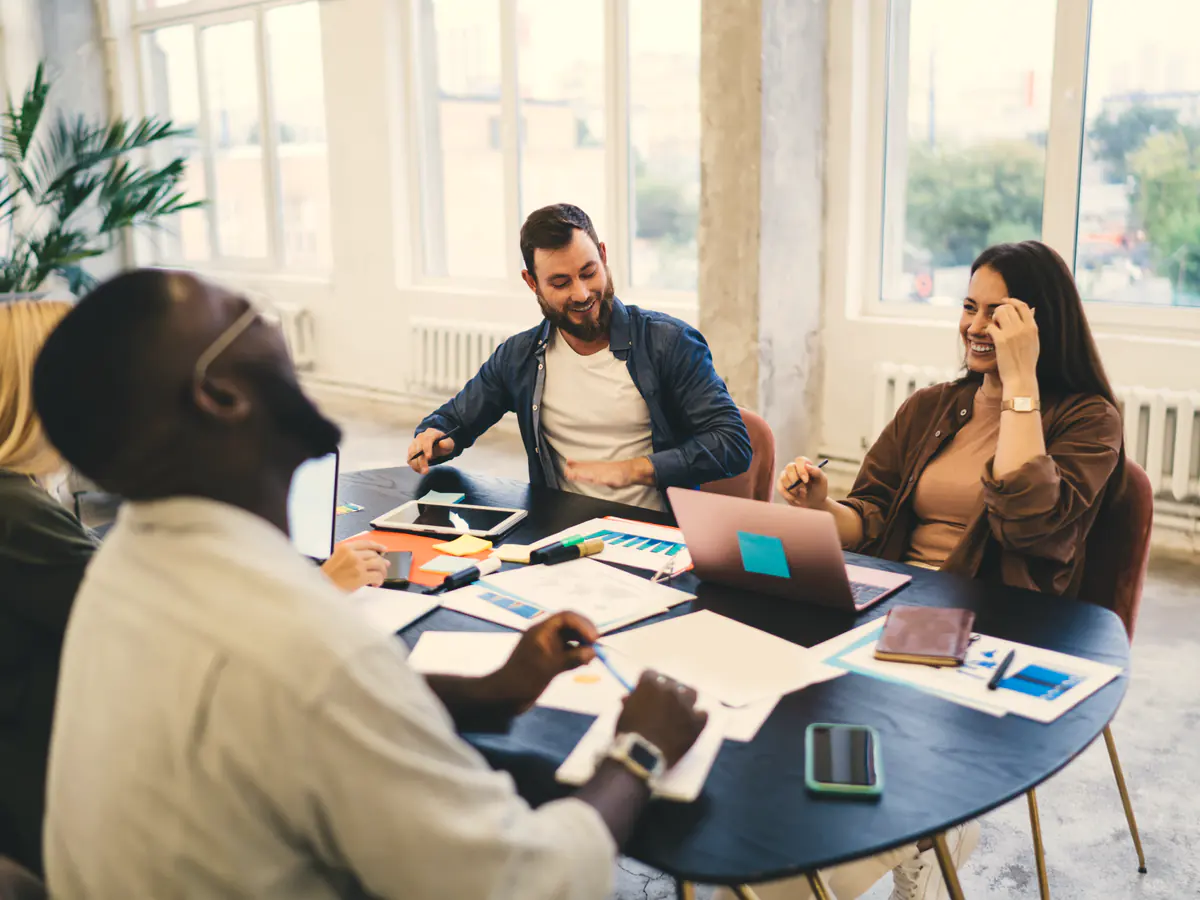 A marketing team discussing campaign results around a table