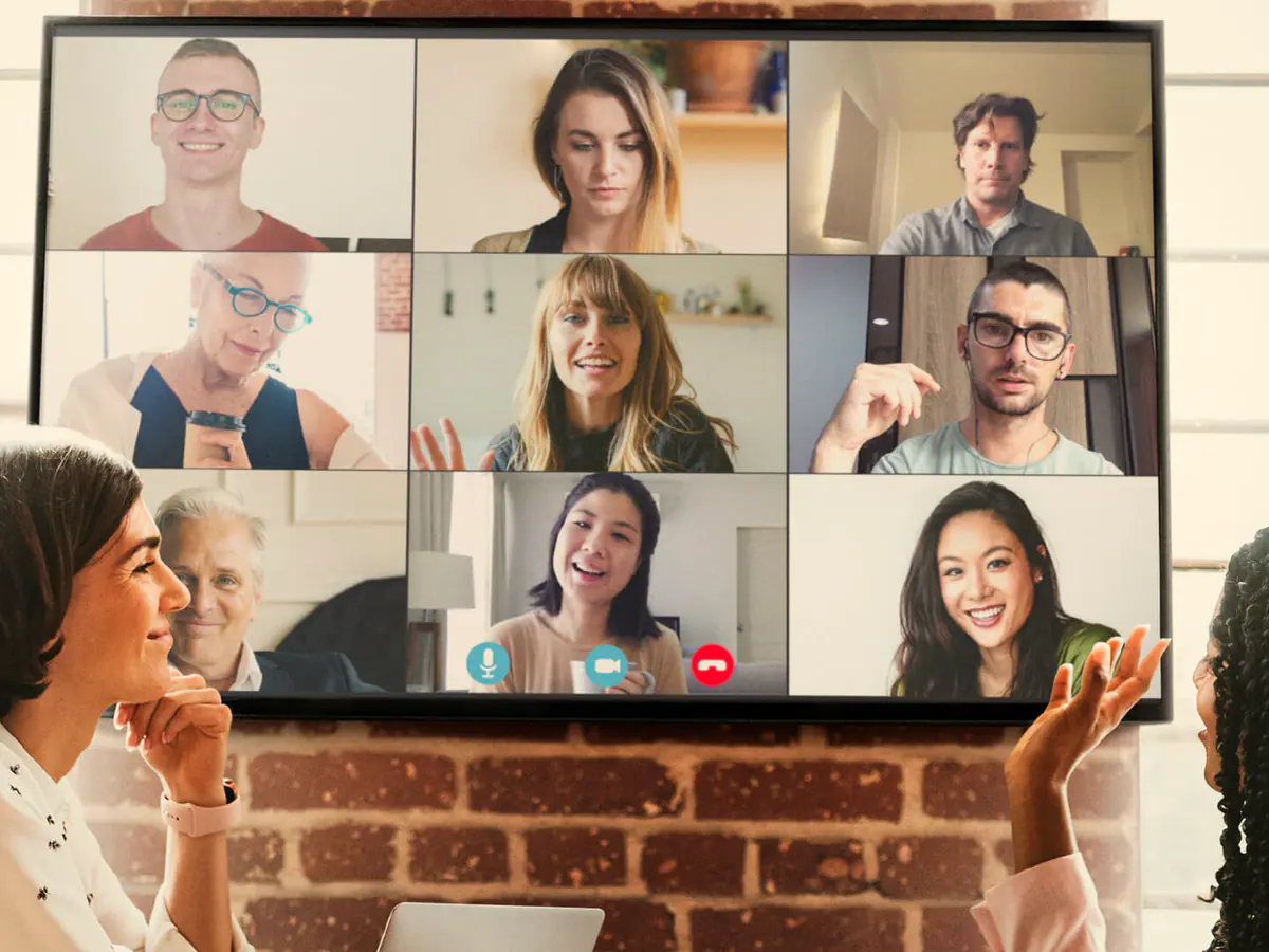 A trainer leading an online session with participants on screen