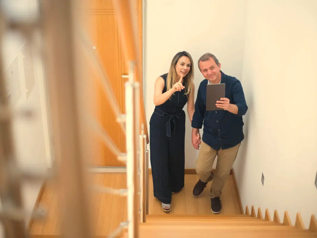 An estate agent showing buyers around a home